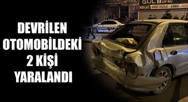 DEVRİLEN OTOMOBİLDEKİ 2 KİŞİ YARALANDI